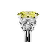 Fancy Yellow Oval Cut Diamond Cluster Ring Set in Silver with Round Accent Stones and Prong Setting on a Plain Band