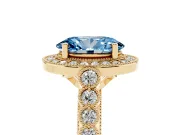 Fancy Blue Oval Cut Diamond Milgrain Halo Solitaire Ring Set in Yellow gold with Bezel Set Side Stones and Pavé Band