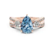 Fancy Blue Three-Stone Pear Cut Diamond Twist Band Ring Set in Rose gold with Pavé Accents and Prong Setting