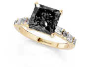 Fancy Black Princess Cut Diamond Solitaire Set in Yellow gold with Side Baguettes and Channel Set Band