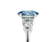 Fancy Blue Three-Stone Oval Cut Diamond Ring Set in White gold with Pear Side Stones and Prong Setting