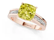 Fancy Yellow Cushion Cut Diamond Solitaire Ring Set in Rose gold with Channel-Set Band and Prong Setting