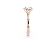 Pear Cut Diamond Solitaire Ring Set in Rose gold with Bezel Set Side Stones and Prong Setting