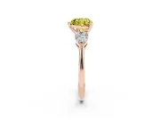 Fancy Yellow Three-Stone Heart Cut Diamond Ring Set in Rose gold with Pear Side Stones and Prong Setting