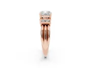 Three-Stone Cushion Cut Diamond Channel Set Ring Set in Rose gold with Bar Prongs