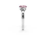 Fancy Pink Oval Cut Diamond Three-Stone Ring Set in Silver with Bold Center and Classic Band