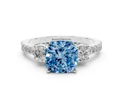 Fancy Blue Three-Stone Cushion Cut Diamond Pavé Band Ring Set in White gold with Prong Setting