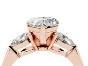 Three-Stone Heart Cut Diamond Ring Set in Rose gold with Pear Side Stones and Prong Setting