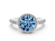 Fancy Blue Round Cut Diamond Halo Engagement Ring Set in Platinum with Pavé Band and Prong Setting