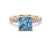Fancy Blue Princess Cut Diamond Pavé Solitaire Ring Set in Yellow gold with Round Band and Prong Setting