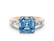 Fancy Blue Asscher Cut Diamond Solitaire Ring Set in Rose gold with Tapered Baguette Side Stones and Prong Setting