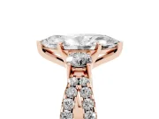 Marquise Cut Diamond Three-Stone Ring Set in Rose gold with Pavé Split Shank and Prong Setting
