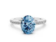Fancy Blue Oval Cut Diamond Pavé Band Ring Set in Platinum with Prong-Set Center Stone