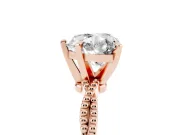 Heart Cut Diamond Solitaire Ring Set in Rose gold with Twisted Band and Bead Prong Setting