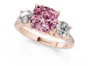 Fancy Pink Three-Stone Cushion Cut Diamond Pavé Band Ring Set in Rose gold with Prong-Set Trio
