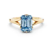 Fancy Blue Emerald Cut Diamond Solitaire Ring Set in Yellow gold with Polished Tapered Band and Prong Setting