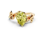 Fancy Yellow Pear Cut Diamond Solitaire Twist Engagement Ring Set in Yellow gold with Pavé Leaf Accents