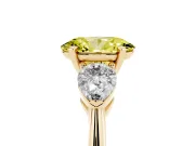Fancy Yellow Three-Stone Oval Cut Diamond Ring Set in Yellow gold with Pear Side Stones and Prong Setting