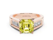 Fancy Yellow Asscher Cut Diamond Solitaire Ring Set in Rose gold with Channel-Set Accent Stones and Prong Setting