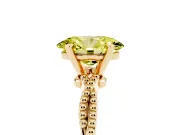 Fancy Yellow Oval Cut Diamond Solitaire Ring Set in Yellow gold with Twisted Band and Bead Prong Setting