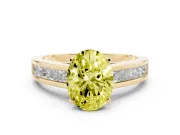 Fancy Yellow Oval Cut Diamond Solitaire Ring Set in Yellow gold with Channel-Set Band and Prong Setting