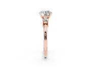 Three-Stone Round Cut Diamond Ring Set in Rose gold with Prong Setting and Plain Band