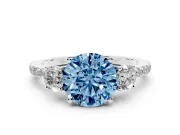 Fancy Blue Round Cut Diamond Three-Stone Ring Set in Silver with Pavé Band and Graduated Sides