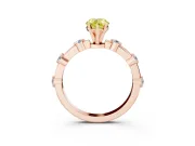 Fancy Yellow Pear Cut Diamond Solitaire Ring Set in Rose gold with Bezel Set Side Stones and Prong Setting