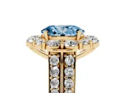Fancy Blue Oval Cut Diamond Halo Engagement Ring Set in Yellow gold with Split Shank and Prong Setting