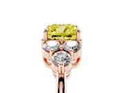 Fancy Yellow Cushion Cut Diamond Solitaire Ring Set in Rose gold with Cluster Accents on Each Side