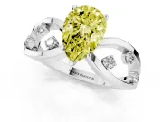 Fancy Yellow Pear Cut Diamond Solitaire Ring Set in Silver with Side Stones on Criss-Cross Band and Prong Setting