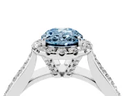 Fancy Blue Oval Cut Diamond Halo Ring Set in Silver with Pavé Band and Raised Center Setting