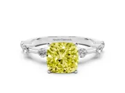Fancy Yellow Cushion Cut Diamond Solitaire Ring Set in White gold with Bezel Set Side Stones and Prong Setting