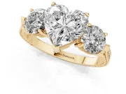 Heart Cut Diamond Three-Stone Ring Set in Yellow gold with Milgrain Band