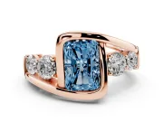 Fancy Blue Radiant Cut Diamond Bezel Bypass Ring Set in Rose gold with Round Accents
