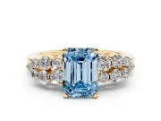 Fancy Blue Emerald Cut Diamond Cluster Engagement Ring Set in Yellow gold with Pavé Band and Prong Setting