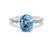 Fancy Blue Oval Cut Diamond Solitaire Engagement Ring Set in Platinum with Bezel Accents on Beaded Band