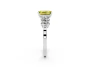 Fancy Yellow Emerald Cut Diamond Cluster Engagement Ring Set in White gold with Pavé Band and Prong Setting