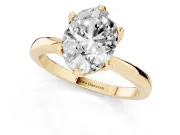 Oval Cut Diamond Solitaire Engagement Ring Set in Yellow gold with Slim Tapered Solitaire Band