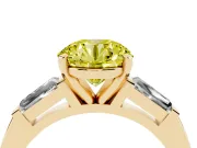 Fancy Yellow Round Cut Diamond Solitaire Ring Set in Yellow gold with Tapered Baguette Side Stones and Prong Setting