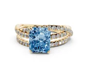Fancy Blue Radiant Cut Diamond Solitaire Twist Band Ring Set in Yellow gold with Pavé Setting and Prong Head