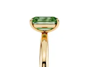 Fancy Green Emerald Cut Diamond Solitaire Ring Set in Yellow gold with Prong Setting on a Polished Plain Band