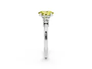 Fancy Yellow Three-Stone Oval Cut Diamond Ring Set in White gold with Prong Setting and Plain Band