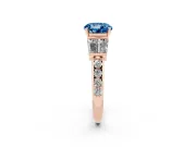 Fancy Blue Round Cut Diamond Engagement Ring Set in Rose gold with Baguette Side Stones and Channel Set Band