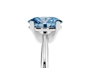 Fancy Blue Oval Cut Diamond Solitaire Ring Set in Silver with Prong Setting on a Plain Round Band