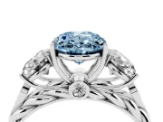 Fancy Blue Oval Cut Diamond Three-Stone Ring Set in Silver with Braided Band