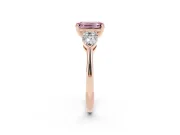 Fancy Pink Three-Stone Emerald Cut Diamond Ring Set in Rose gold with Pear Side Stones and Prong Setting