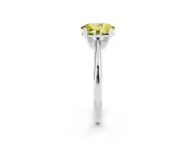 Fancy Yellow Oval Cut Diamond Solitaire Ring Set in White gold with Prong Setting on a Plain Round Band