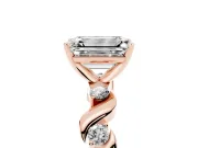 Emerald Cut Diamond Solitaire Ring Set in Rose gold with Ribbon Twist Band, Round Accents and Prong Setting