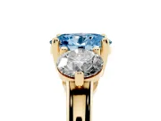 Fancy Blue Oval Cut Diamond Three-Stone Ring Set in Yellow gold with Prong Setting and Classic Band